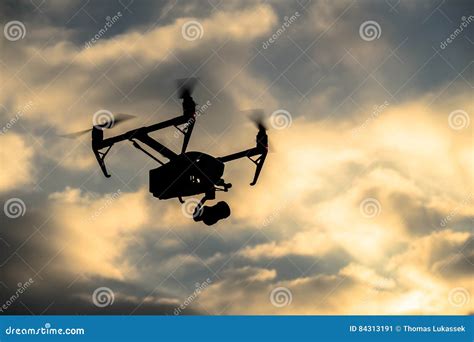 Drone Silhouette Flying in the Evening Sky Stock Image - Image of ...