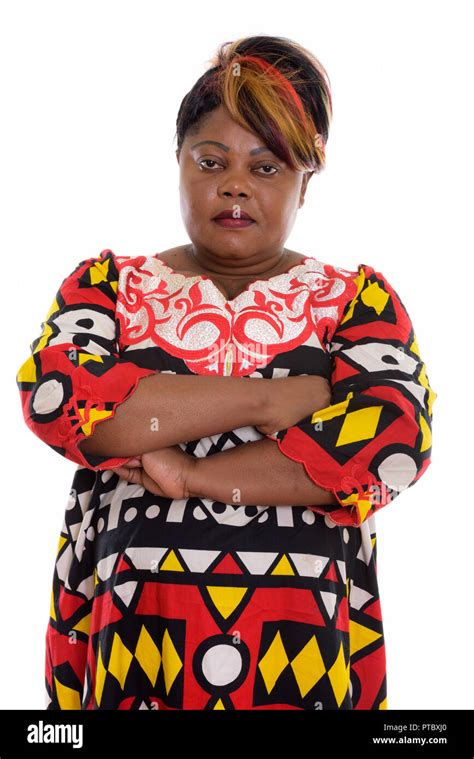 Studio Shot Of Fat Black African Woman With Arms Crossed Stock Photo