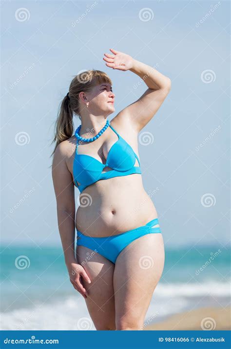 Overweight Middle Aged Woman In Blue Bikini At The Sea Stock Photo