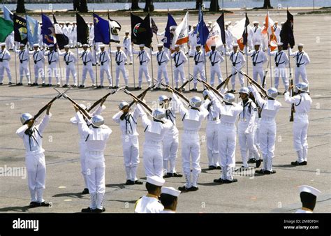 A United States Us Navy Drill Team Performs A Rifle Routine During A