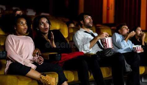 Shocked Audience Watching a Horror Movie Stock Image - Image of ...