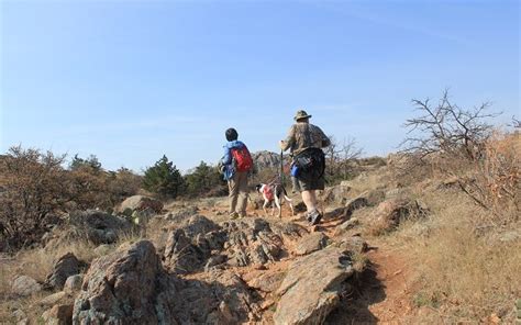 Hiking with a dog at Wichita Mountains Wildlife Refuge, Oklahoma. - TWO WORLDS TREASURES