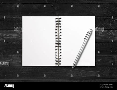 Blank Open Spiral Notebook And Pen Mockup Isolated On Black Wood