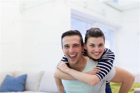 Handsome Man Piggybacking His Girlfriend Stock Photo At Vecteezy