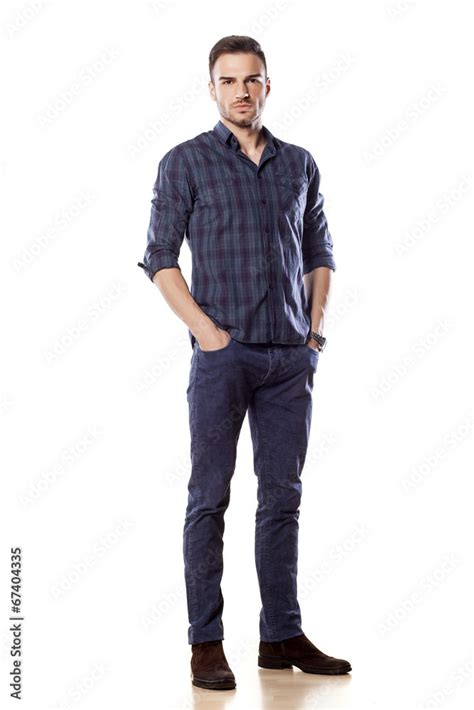 Young Man Posing With His Hands In Pockets Stock Photo Adobe Stock