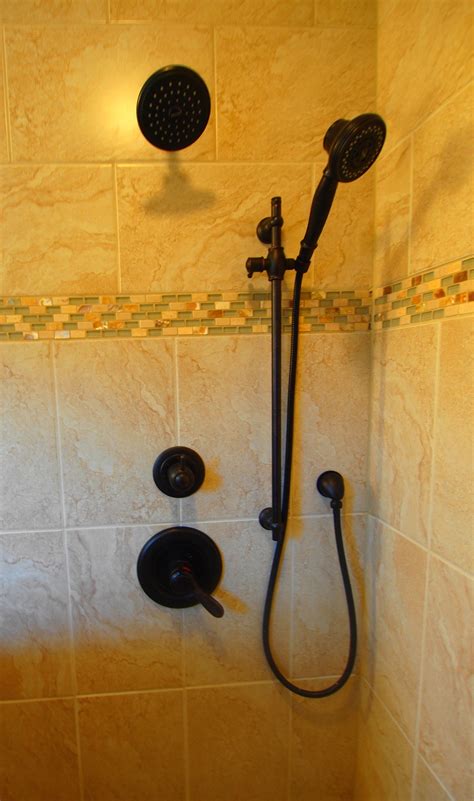 oil rubbed bronze shower system with handheld - kauffman-mezquita