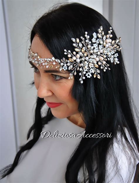 A Woman With Long Black Hair Wearing A White Dress And A Head Piece