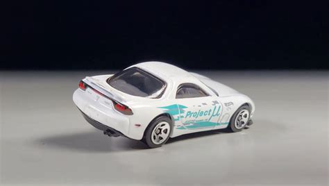 Машинка Базова Hot Wheels Mazda RX J Imports HTC White купити в інтернет магазині