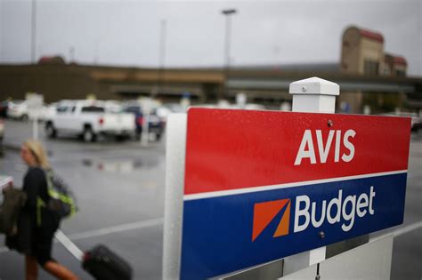 avis budget group cuts guidance wsj