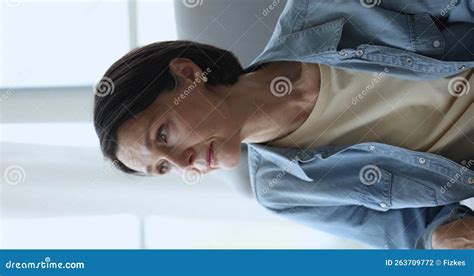 Pensive Older Woman Staring Into Distance Seated Indoors Stock Footage