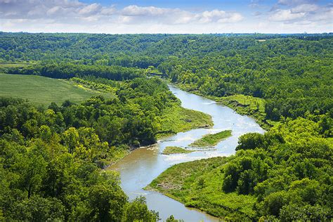 River Winding Through Lush Forest Landscape Photograph By Donald