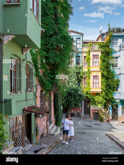 Traditional Colorful Old Houses In Balat District With Tourists Taking
