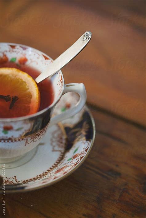 Midsection View Of Vintage Porcelain Teacup With Fruits Infusion