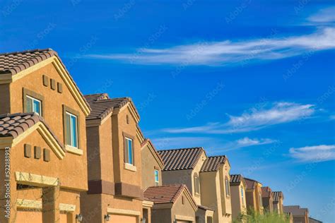 Side view of row of houses in the suburb neighborhood in Tucson, Arizona Stock Photo | Adobe Stock