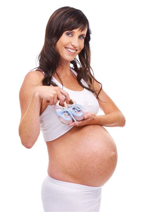 Woman Pregnant And Studio With Portrait Smile And Baby Shoes For