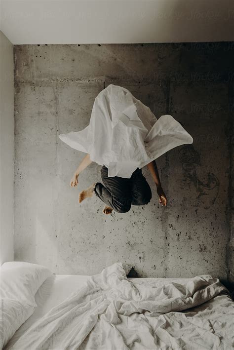 Ghost Like Figure Of A Woman Wearing A Bed Sheet Over Her Head While