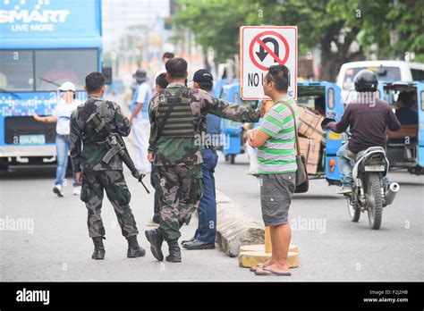 Armed Police In General Santos City In The Philippines Due To The Long