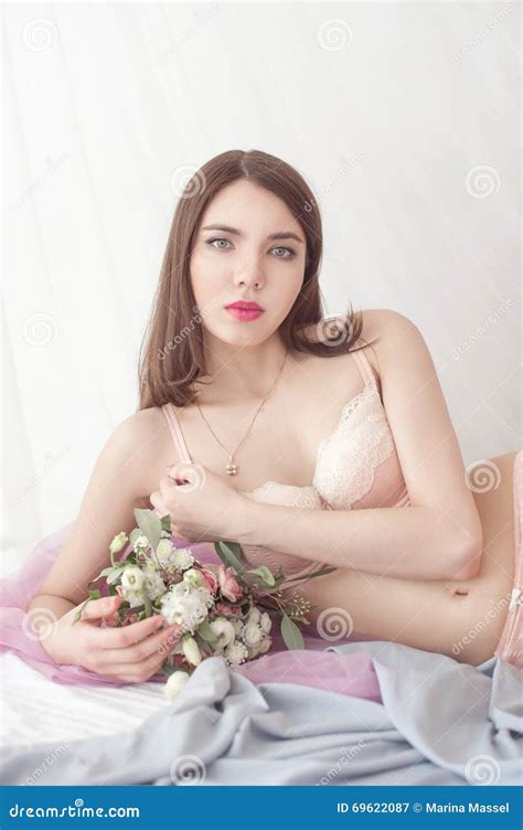 Woman With Dark Hair In Lingerie Lying On The Bed Stock Image Image