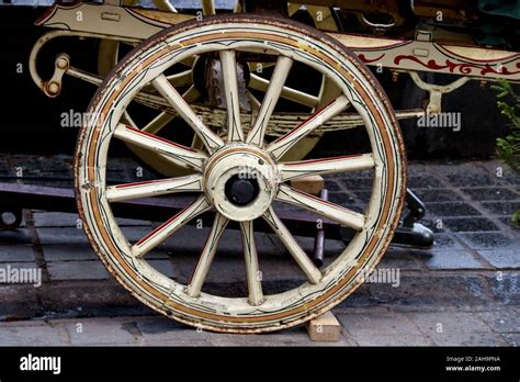 Old Painted Wooden Gypsy Caravan Wheel At A Country Fair Stock Photo