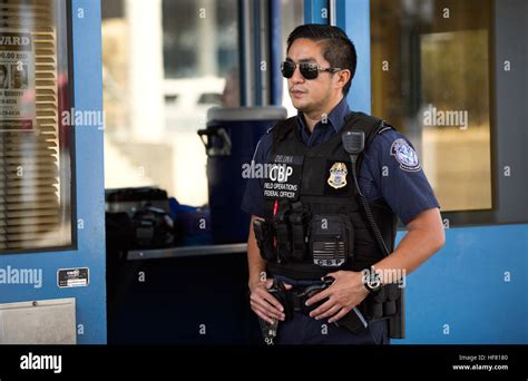 A Us Customs And Border Protection Officer Awaits The Next Arriving