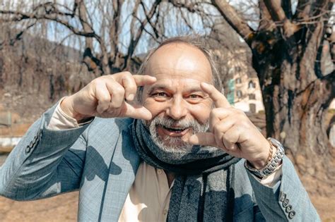 Premium Photo Portrait Of A Confident Handsome Mature Man Pensioner Grandfather In The Small Town
