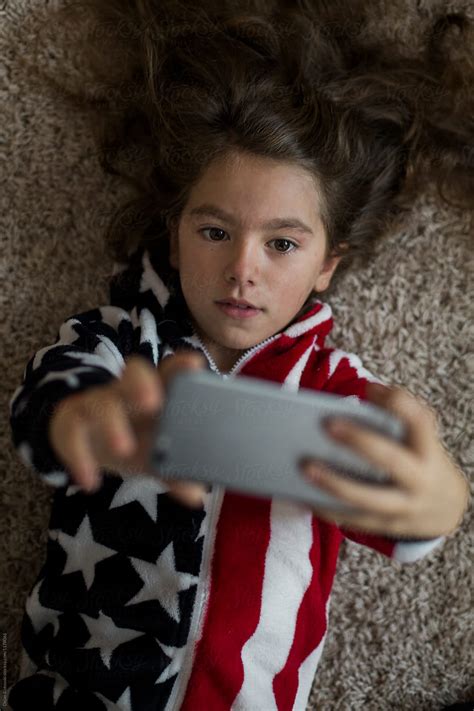 Girl With American Flag Taking Selfie By Stocksy Contributor Dejan