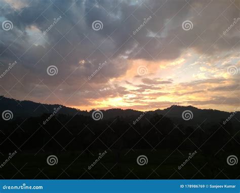 Sunset View with Hill and Clouds Stock Image - Image of hill, clouds ...