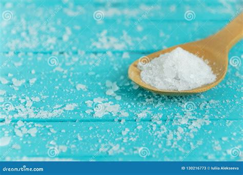 Sea Salt In A Wooden Spoon On Turquoise Stock Image Image Of