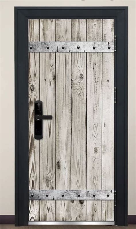 An Open Wooden Door With Metal Bars On The Front And Side Against A