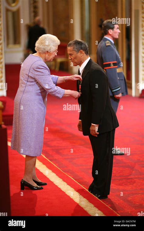 Mr Rick Wayne Is Made An Obe By The Queen At Buckingham Palace Stock