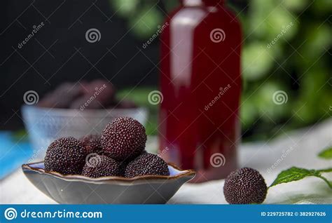 Fresh Red Bayberry And Red Bayberry Juice Stock Photo Image Of