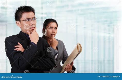 Two Asian Business People Thinking Stock Photos Image 17950023