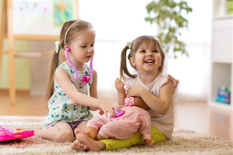 Two Kids Girls Playing Doctor With A Doll Mamy Mamompl