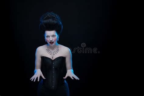 Portrait Of The Actress Brunette Woman With High Hair In A Diamond