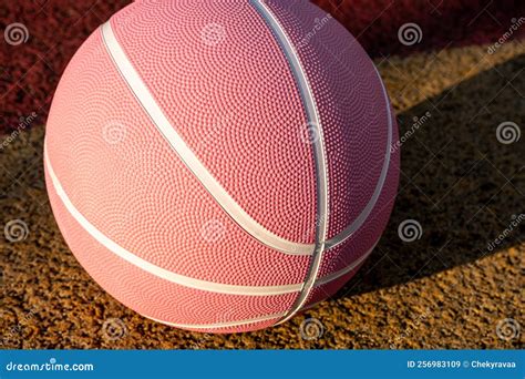 Pink Basketball Ball On The Ground Close Up Ball On The Red Court