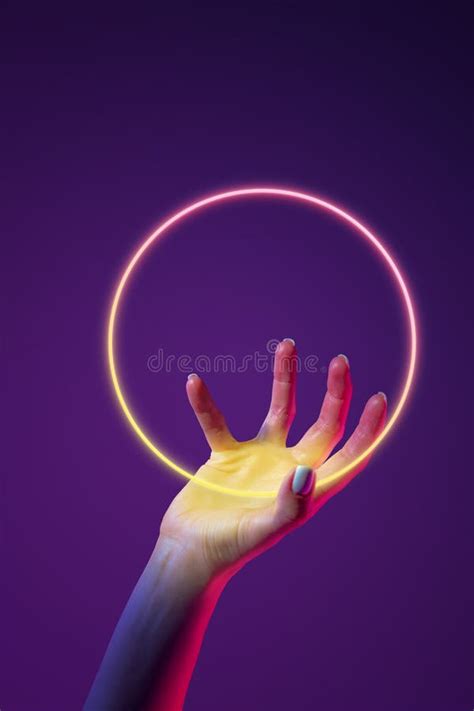 Portrait With Human Hand Holding Neon Glowing Sphere Over Abstract