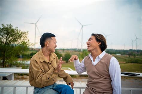 Group Of Two Lgbtq Friends Sitting And Talking Laughing Happy On The