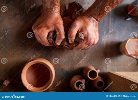 Male Potter Molding A Clay In Pottery Workshop Close Up Selective