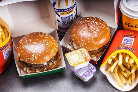 Burgers With French Fries Cola And Sauces From Mcdonald S Restaurant