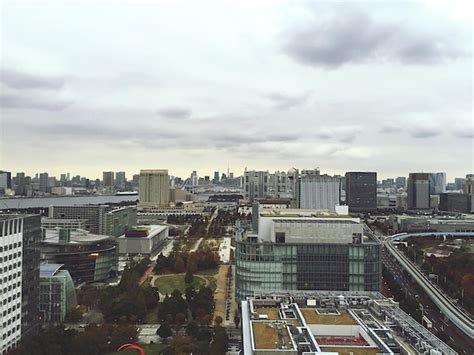 Premium Photo Cityscape Against Cloudy Sky