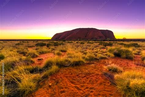 Dramatic Dawn Sky Behind Monolith Ayers Rock Colors Of Sky At Uluru At