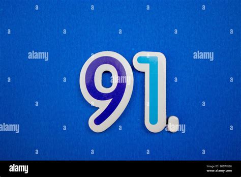 The Number 91 In Light Blue Color Photographed From Above Placed On A