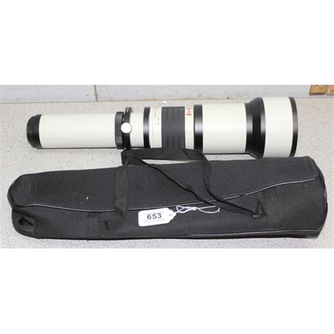 An Opteka 650 1300mm High Definition Telephoto Zoom Lens In Case