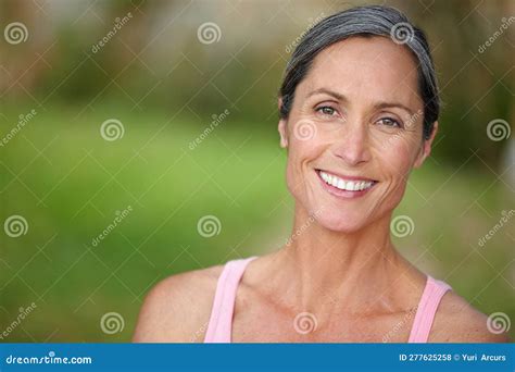 Feeling So Relaxed In The Outdoors Portrait Of An Attractive Mature