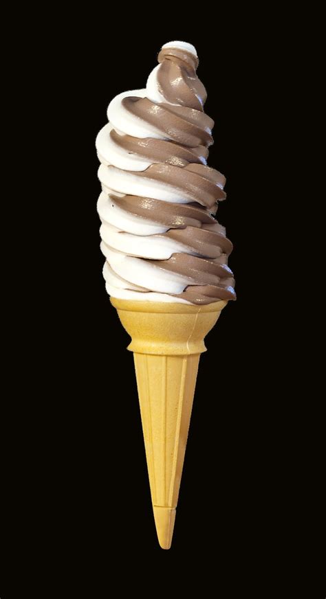 Soft Serve Ice Cream Cone With Chocolate And White Icing