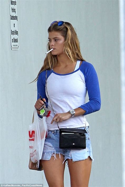 Nina Agdal Puffs On Cigarette While Riding Her Bike Through Miami