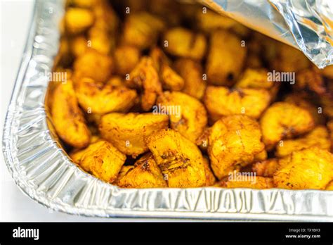 Diced Nigerian Plantain In Aluminum Container Served At Nigerian Party