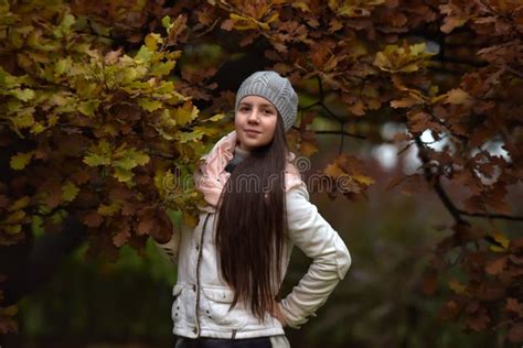 Portrait Of A Dark Haired Girl Among Autumn Leaves Stock Photo Image Of Channels Brunette