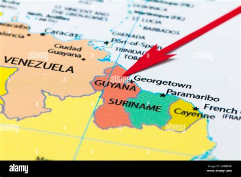 Red Arrow Pointing Guyana On The Map Of South America Continent Stock