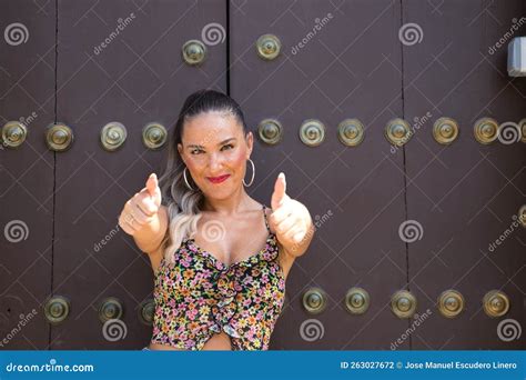 Portrait Of Very Attractive Young Blonde Woman Shows Thumbs Up With